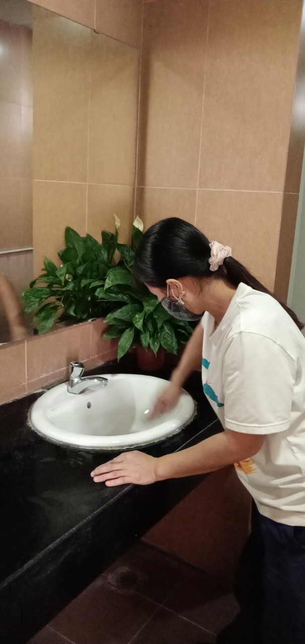 A picture containing wall, indoor, person, toiletDescription automatically generated