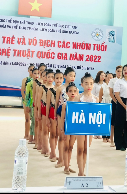 A group of women holding a signDescription automatically generated with medium confidence