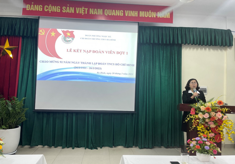 A person standing at a podiumDescription automatically generated with low confidence