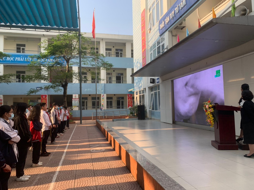 A group of people standing outside a buildingDescription automatically generated with low confidence