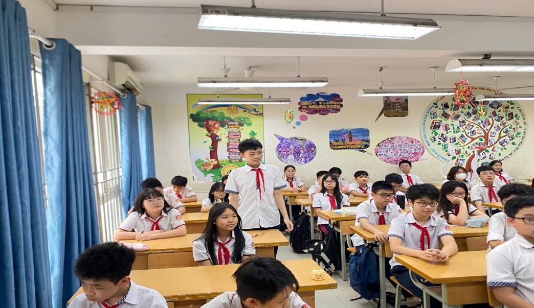 A group of students in a classroomDescription automatically generated