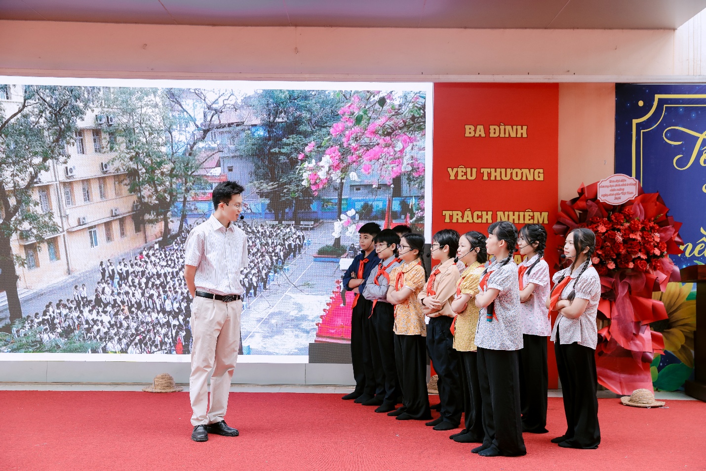 A person standing in front of a group of childrenAI-generated content may be incorrect.