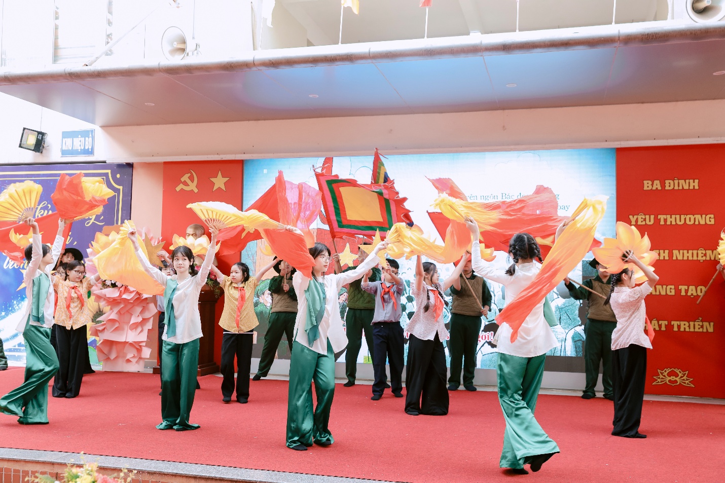 A group of people dancing on a red carpetAI-generated content may be incorrect.