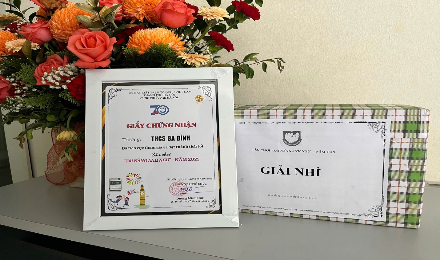 A bouquet of flowers next to a white frameAI-generated content may be incorrect.