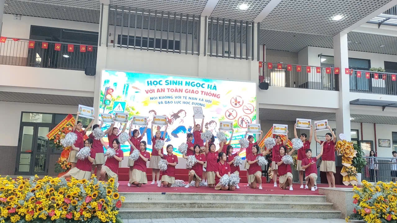 A group of cheerleaders on a stage

Description automatically generated