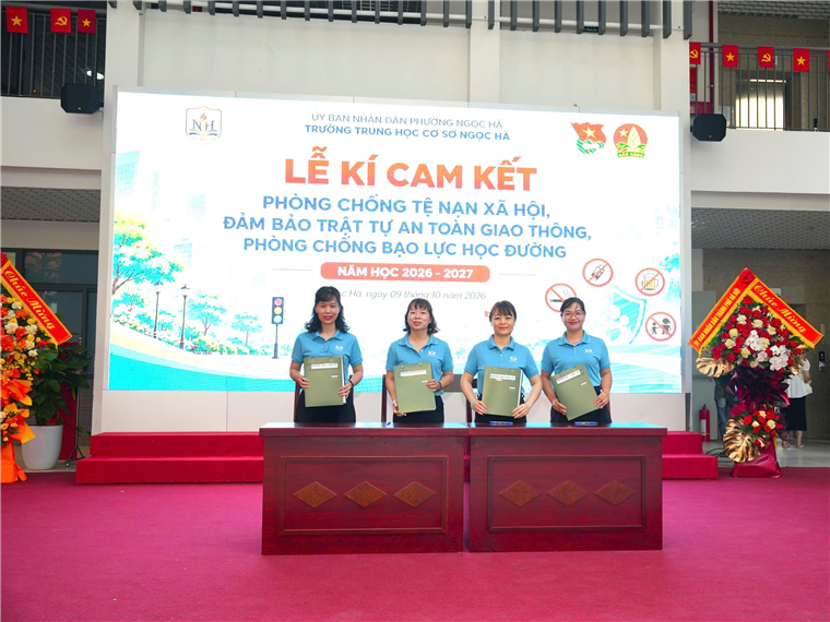 A group of people standing on a podium

Description automatically generated