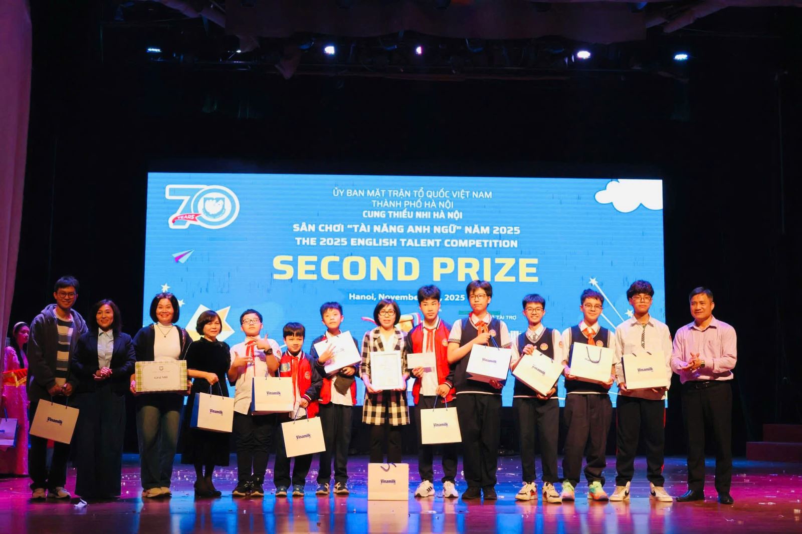 A group of people holding signsAI-generated content may be incorrect.